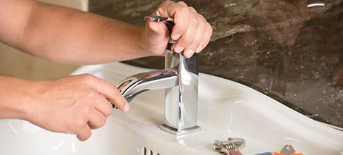 plumber-repairing-faucet